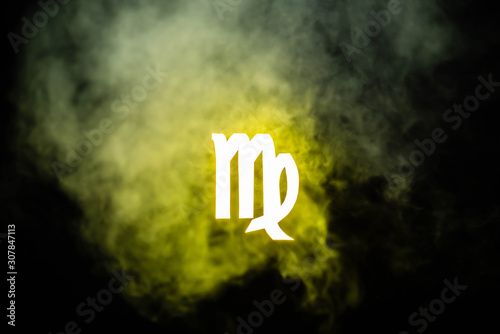 yellow illuminated Virgo zodiac sign with smoke on background