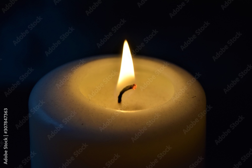 Candle light flame closeup with dark background Stock Photo | Adobe Stock