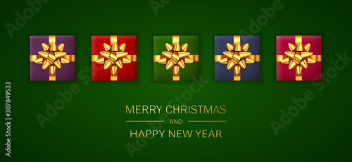 Christmas Gifts with Golden Holiday Bow on Green Background
