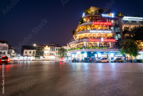 Dong Kinh Nghia Thuc Square in the Old Quarter of Hanoi, Vietnam at twilight. Street with copyspace and blurred buildings on background photo