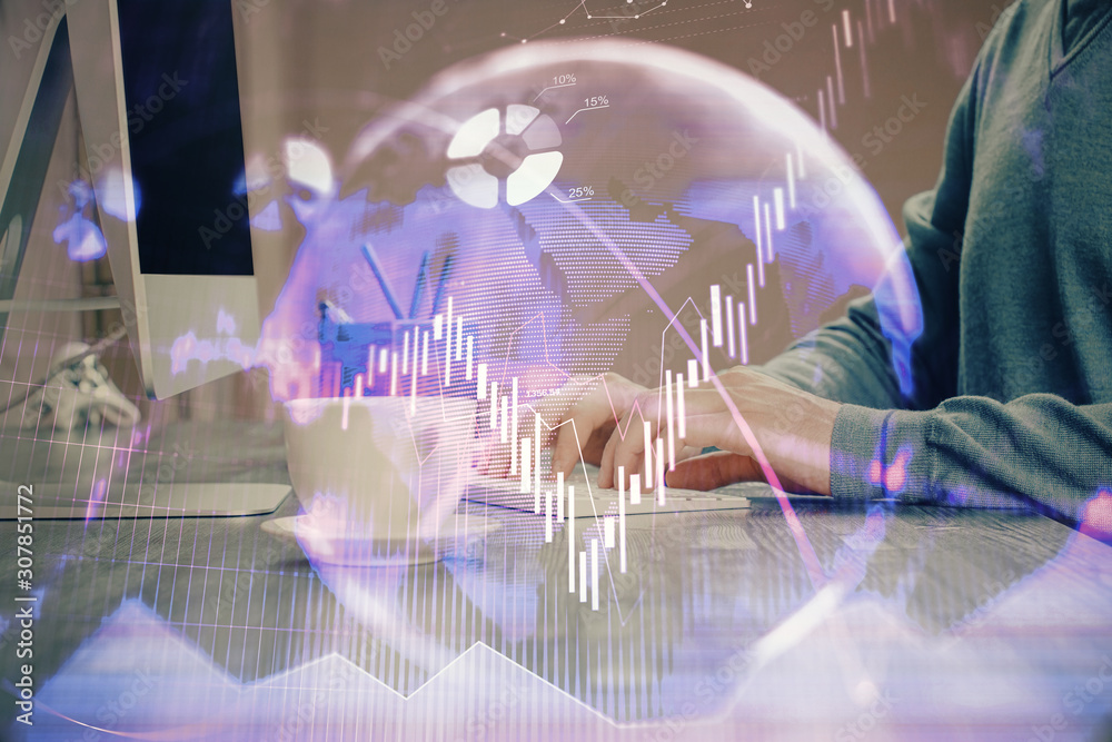 Multi exposure of graph with man typing on computer in office on background. Concept of hard work. Multi exposure of graph with man typing on computer in office on background. Concept of hard work.