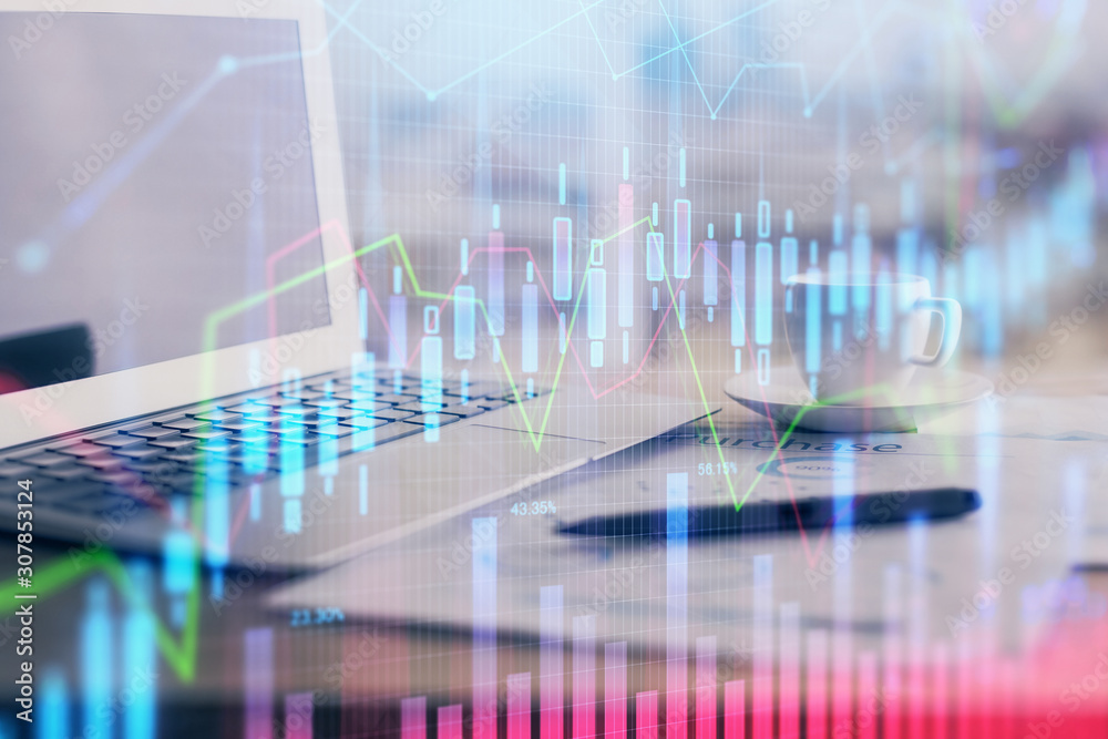 Forex graph hologram on table with computer background. Double exposure. Concept of financial markets. Forex graph hologram on table with computer background. Double exposure. Concept of financial markets.