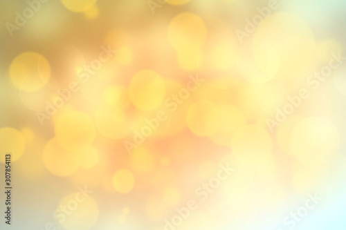 Yellow blurred bokeh abstract lights background,golden backdrop. © nys