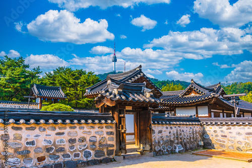 Namsangol traditional village and seoul tower at autumn color ,south korea. photo