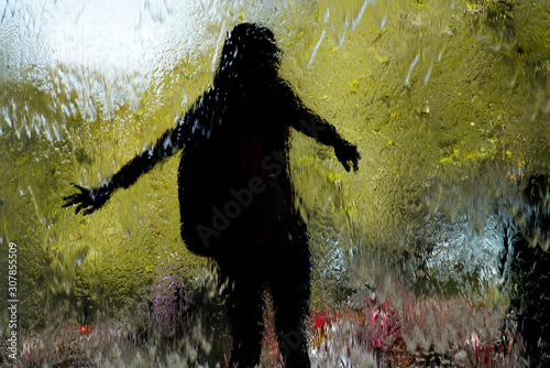 Glass wall with water child playing, National Gallery of Victoria, Melbourne, Australia photo