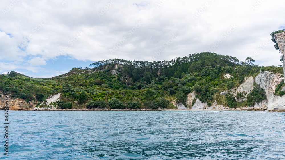 View of cliffs and ocean from Te Whanganui-A-Hei Cathedral Cove Marine Reserve in Coromandel Peninsula, New Zealand