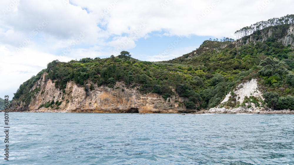 View of sea caves from Te Whanganui-A-Hei Cathedral Cove Marine Reserve in Coromandel Peninsula, New Zealand