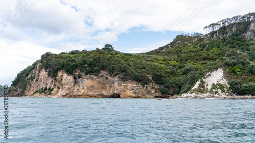 View of sea caves from Te Whanganui-A-Hei Cathedral Cove Marine Reserve in Coromandel Peninsula, New Zealand