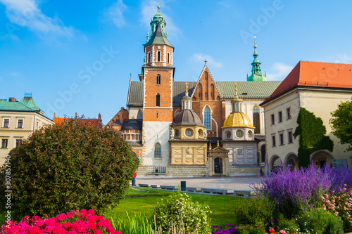 The Royal Archcathedral Basilica of Saints Stanislaus and Wenceslaus on the Wawel Hill near the castle. Beautiful flower garden. Krakow, Poland