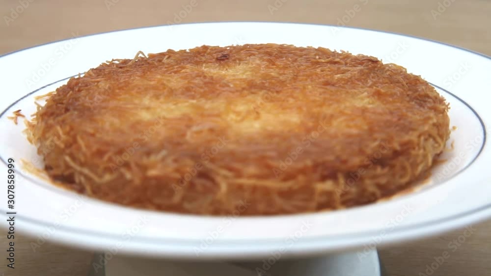 Kunefe dessert served on a original plate - Turkish Künefe Kunefe dessert served on a original plate - Turkish Künefe