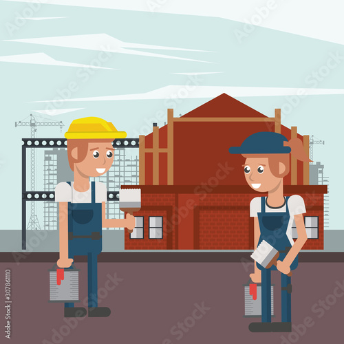 couple of builders working under construction scene