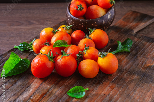 .Fresh tomatoes on wooden background
