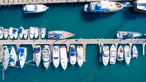 Top view of luxury yachts in the harbor, aerial shoot with drone