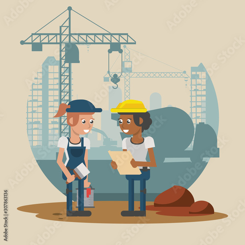 couple of builders working under construction scene