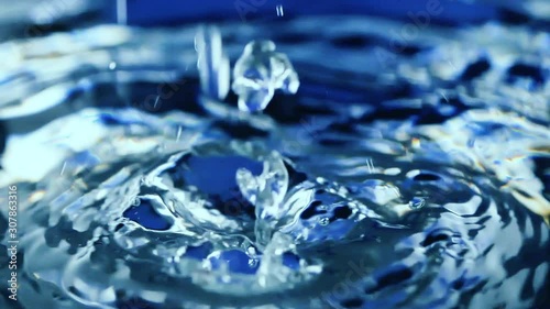 Water drop falling down. Slow motion