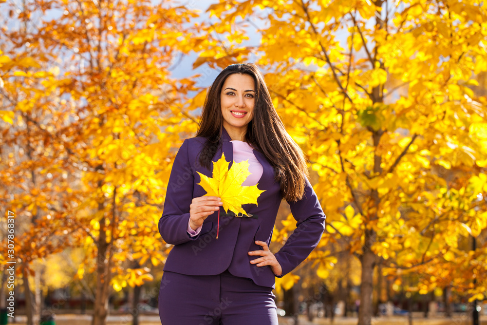 Happy business woman in autumn park Happy business woman in autumn park