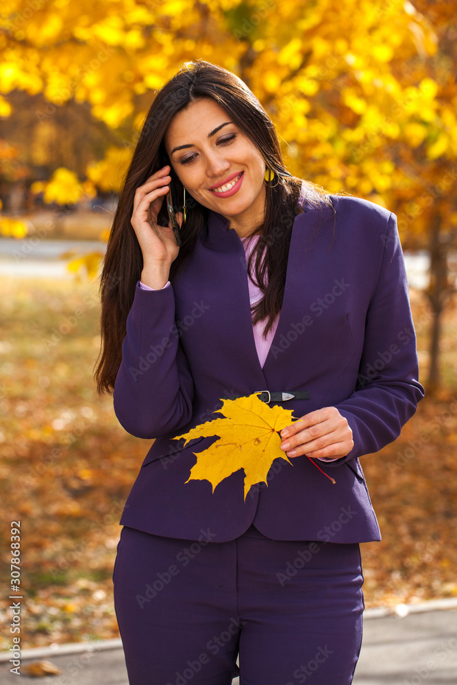 Portrait of a young beautiful model calling by smart phone Portrait of a young beautiful model calling by smart phone