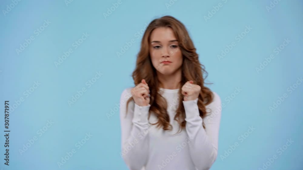 woman with crossed fingers isolated on blue woman with crossed fingers isolated on blue
