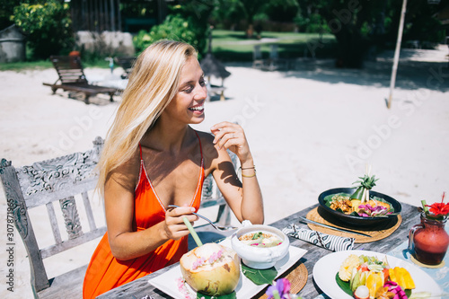 Smiling female enjoying exotic meal on vacation © BullRun