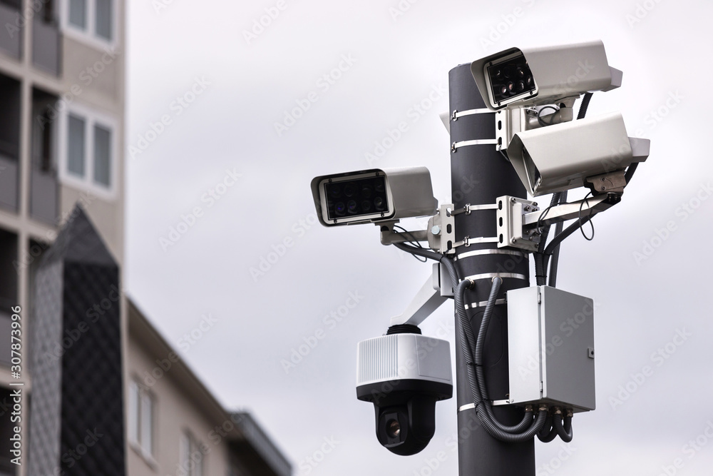modern camera surveillance tower in the city modern camera surveillance tower in the city