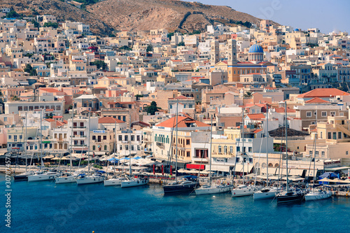 SYROS, GREECE - JUNE 26, 2019: casual from city port side streets and building at summer time