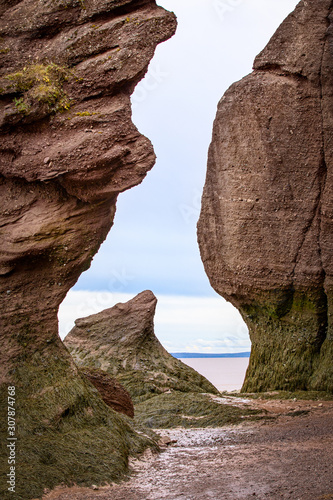 A unique point of view where the sandstone rock formations, form a semblance of the tail of a whale at Hopewell Rocks, New Brunswick, Canada © Manpreet