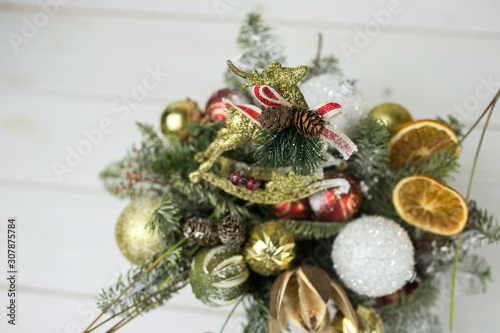 New year christmas decoration with spices, cinnamon, mandarin, eve on white wooden background