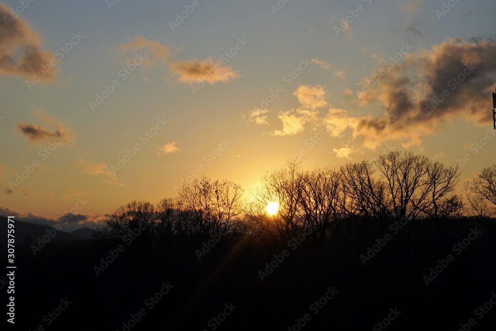 Sunset Over the Blue Ridge Mountain in Autumn with Leafless Trees Sunset Over the Blue Ridge Mountain in Autumn with Leafless Trees