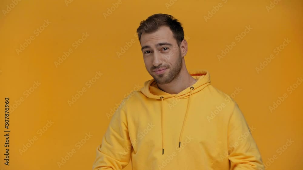 man pointing with finger isolated on yellow man pointing with finger isolated on yellow