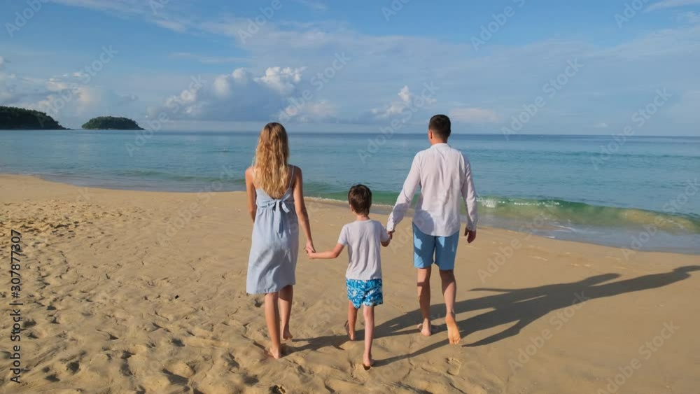 happy family vacation tourism travel trip in beach. Couple with child traveler man woman girl little boy walking outdoors. tourists mother father son tropical sea ocean sand surf holiday, slow-mo 4 K happy family vacation tourism travel trip in beach. Couple with child traveler man woman girl little boy walking outdoors. tourists mother father son tropical sea ocean sand surf holiday, slow-mo 4 K
