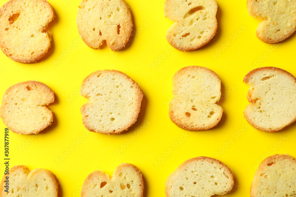 Flat lay with crackers on yellow background, close up Flat lay with crackers on yellow background, close up