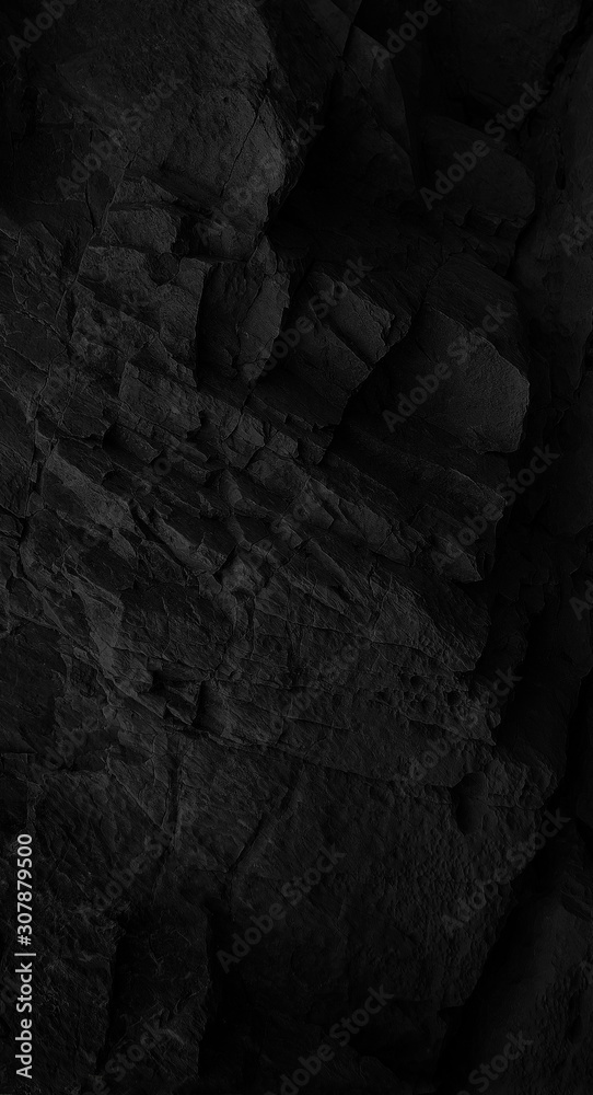 Dark Face Shabby Cliff Face And Divided By Huge Cracks And Layers. Coarse, Rough Gray Stone Or Rock Texture Of Mountains, Background And Copy Space For Text On Theme Geology And Mountaineering.