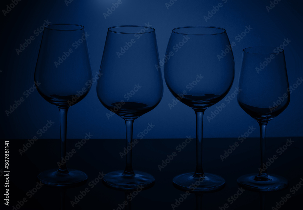Wine glasses on blue