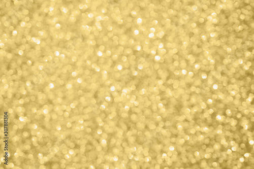 Abstract blur gold glitter sparkle defocused bokeh light background