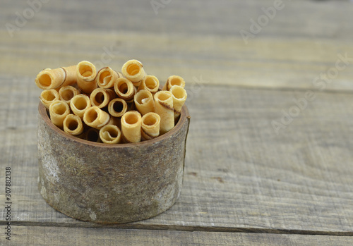 Vanillia waffle roll stick in bowl wooden photo