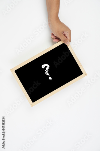 Question mark symbol on a black board