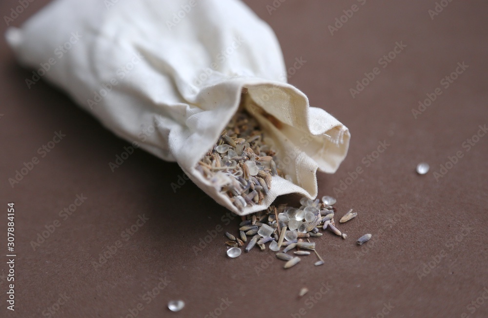 Obraz premium Bath-taking salt and lavender seeds for smell are spread on the table