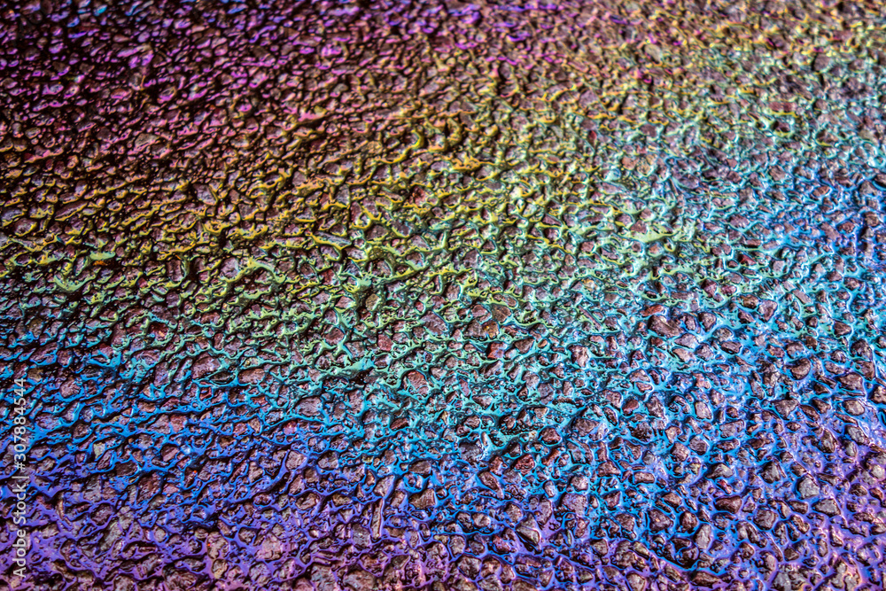 Obraz premium Petrol Oil Pollution Rainbow Gasoline Leak on Pavement