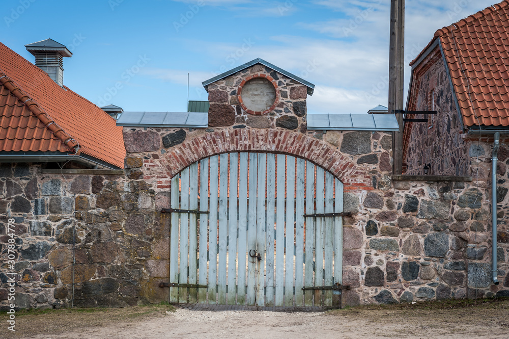 Old fence and wooden gateway. Olustvere manor. Estonia. Old fence and wooden gateway. Olustvere manor. Estonia.