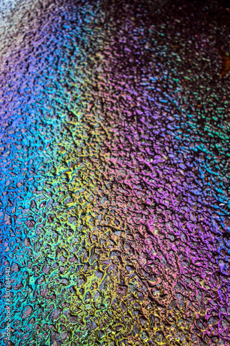 Petrol Oil Pollution Rainbow Gasoline Leak on Pavement © squeebcreative