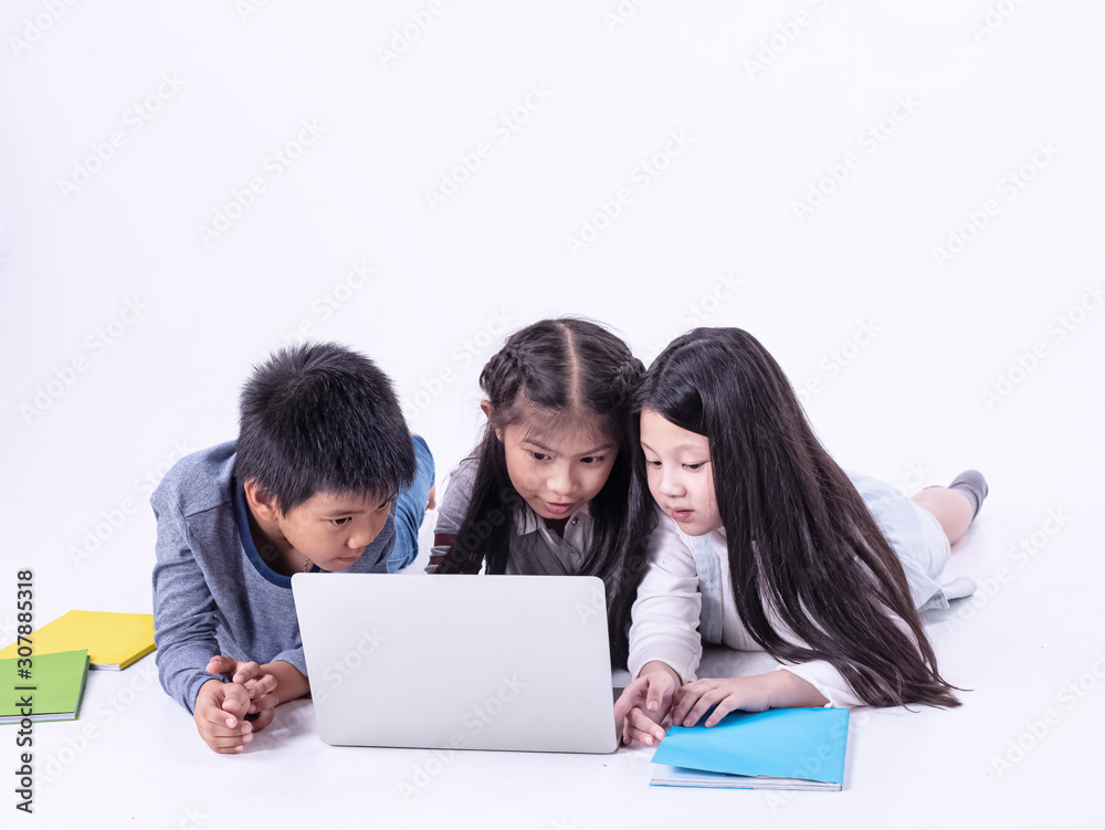 Group of children using laptop for searching data,with interested feeling,doing activity together,smart kids Group of children using laptop for searching data,with interested feeling,doing activity together,smart kids