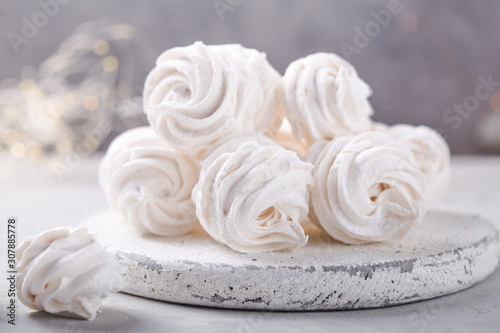 Wallpaper Mural White zephyr on grey concrete background. Set of homemade marshmallow Meringue, pansy. Russian sweetness cusine Torontodigital.ca