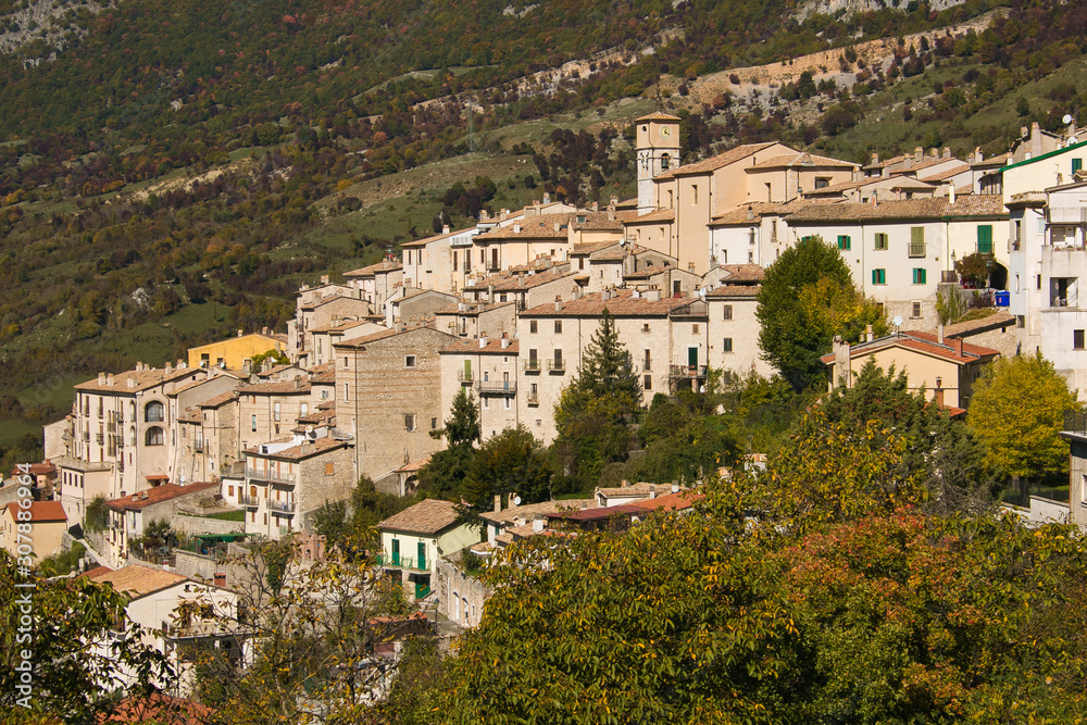 Fototapeta premium Barrea, Italy: the Historical Typical Village Houses with Green Mountain Landscape