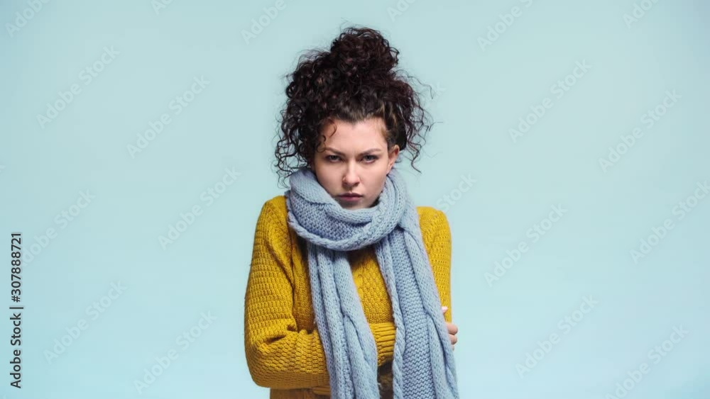 sick girl freezing isolated on blue sick girl freezing isolated on blue
