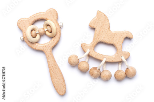 Baby wooden rattles and toys on white backgroun isolated