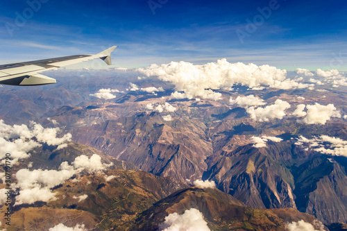 Andes Mountains, Peru - Airplane Wing Window View on Flight over the Colorful Andes Mountains in Peru