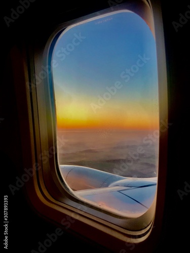 Beautiful view from airplane window  large wing of aircraft shows casement