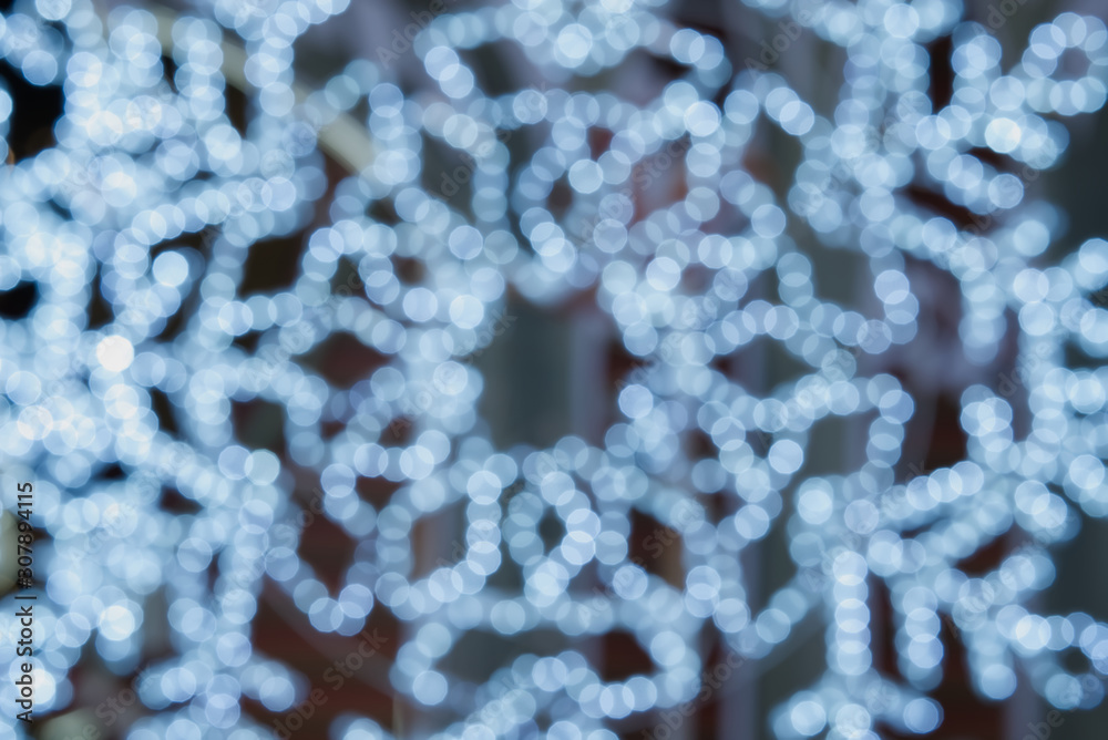 The blue circle bokeh resembles snow in a row, branching out like a branch. Use as a beautiful background