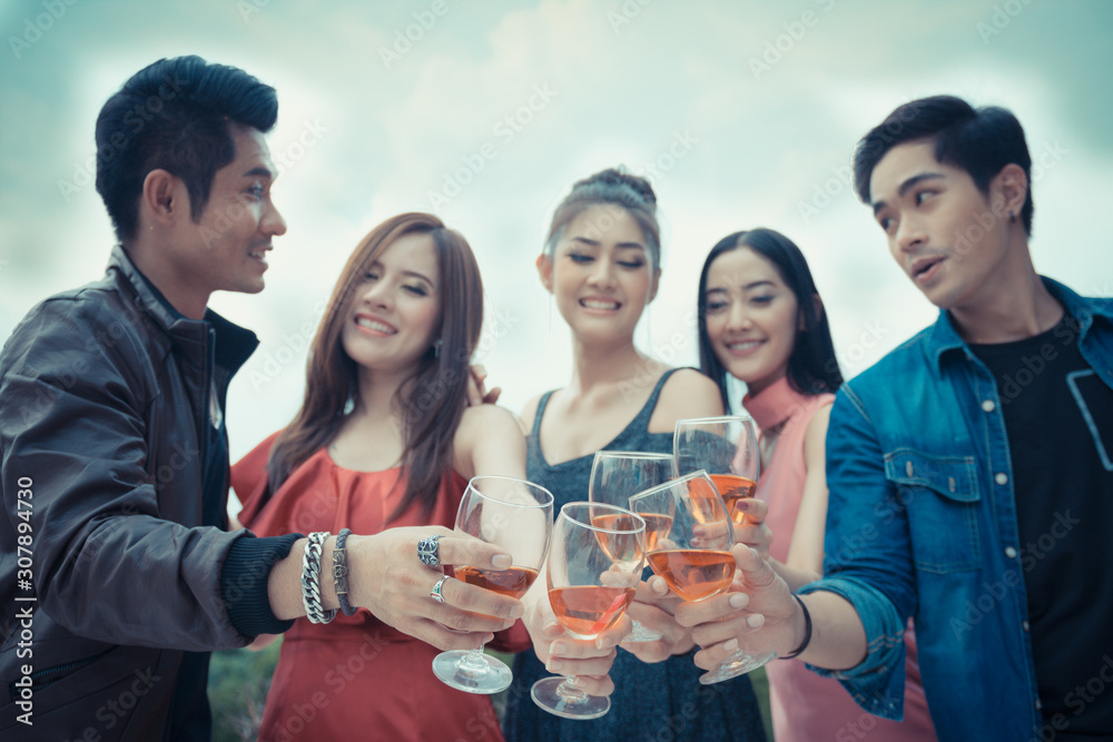 Asia people hands holding glasses of wine making a toast together , celebration concept. Asia people hands holding glasses of wine making a toast together , celebration concept.