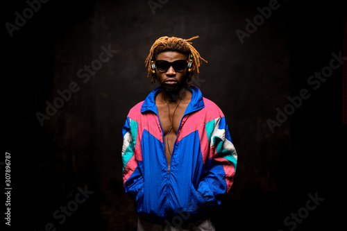Afro american man in glasses with headphones